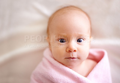Buy stock photo Calm, baby and portrait with towel on bed for comfortable, childhood development and bath in nursery. Sweet, cute and little infant with peace on linen for wrap, wellness and healthy growth at home