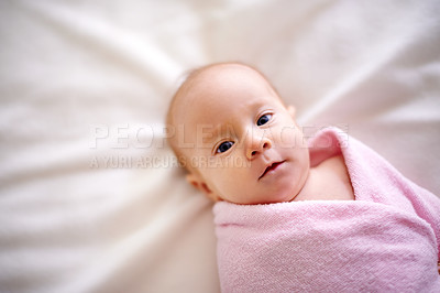 Buy stock photo Calm, baby and portrait with wrap of blanket for comfortable, peace and childhood development. Adorable, infant and top view with face on bed in nursery for healthy growth, sweet and rest at home