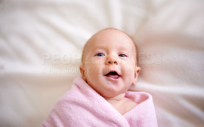 Buy stock photo Blanket, wrap and portrait of baby with smile for comfortable, rest and childhood development. Happy, infant and top view with face on bed in nursery for future growth, cheerful and peace at home