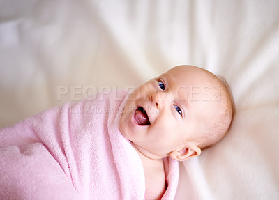 Buy stock photo Baby, infant and happy on bed above with portrait for home, nursing and care with pink blanket. Excited newborn girl with comfort, laughing and curious for sound, hearing and audio health in nursery