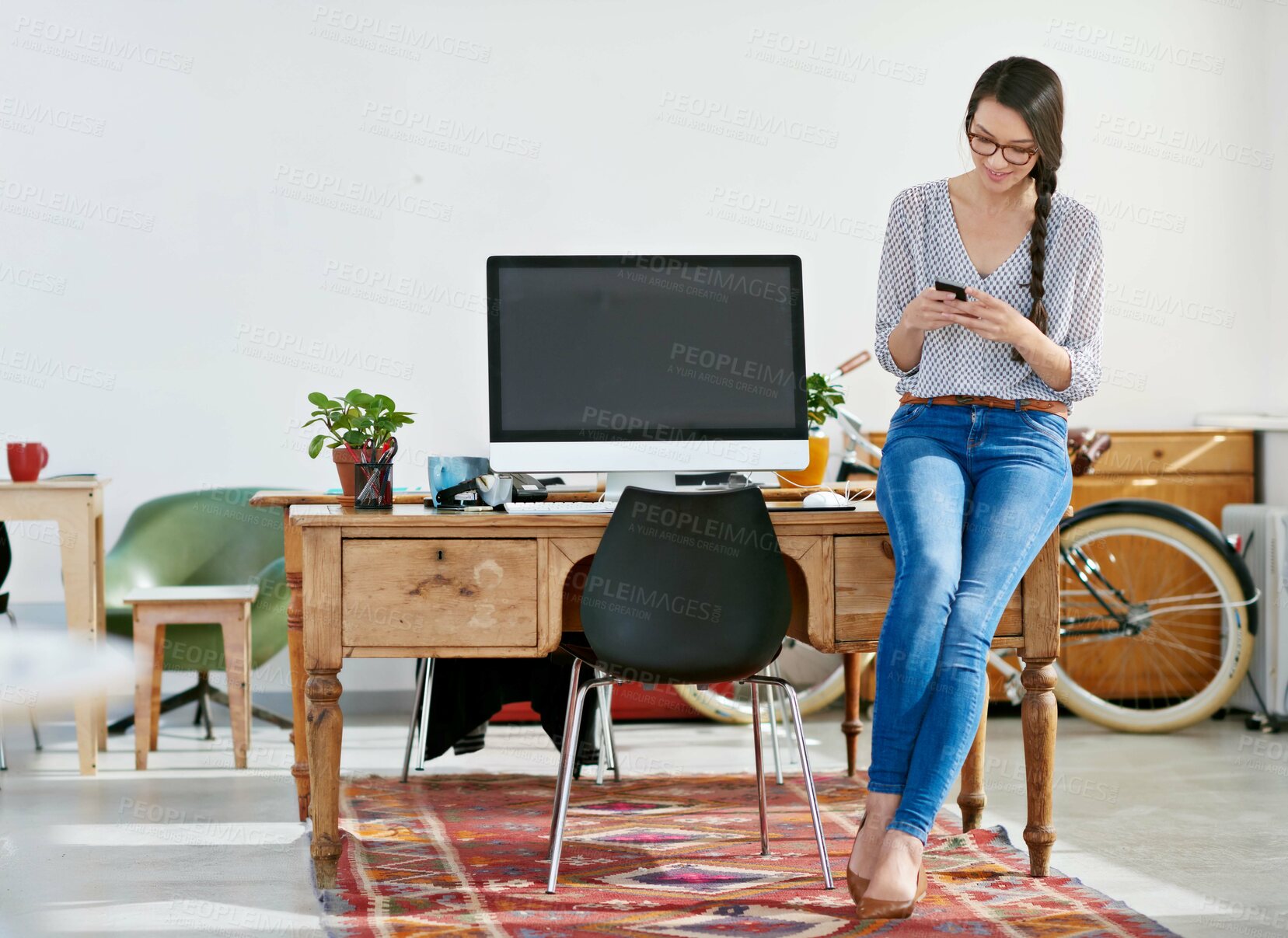 Buy stock photo Woman, office and smile with texting on smartphone for research, online trends and ideas for magazine shoot. Employee, female person and happy for creative business, internet and social media