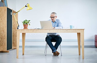 Buy stock photo Mature, business and man with laptop in office for research, information and writing document for project review. Confident, male person and editor with digital, website and email for networking