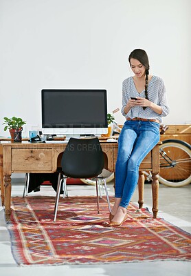 Buy stock photo Woman, office and texting with smartphone for research, online trends and ideas for magazine shoot. Employee, female person and smile for creative business on internet, social media and website