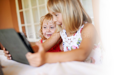 Buy stock photo Excited girls, home and kids on tablet for streaming online for movies, cartoons and videos on technology. Surprise, wow or children siblings, touchscreen and learning development or games website