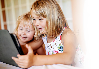 Buy stock photo Girls, house and kids on tablet for streaming online for movies, cartoons and videos on technology. Family, home and children siblings with touchscreen for learning development or fun games website