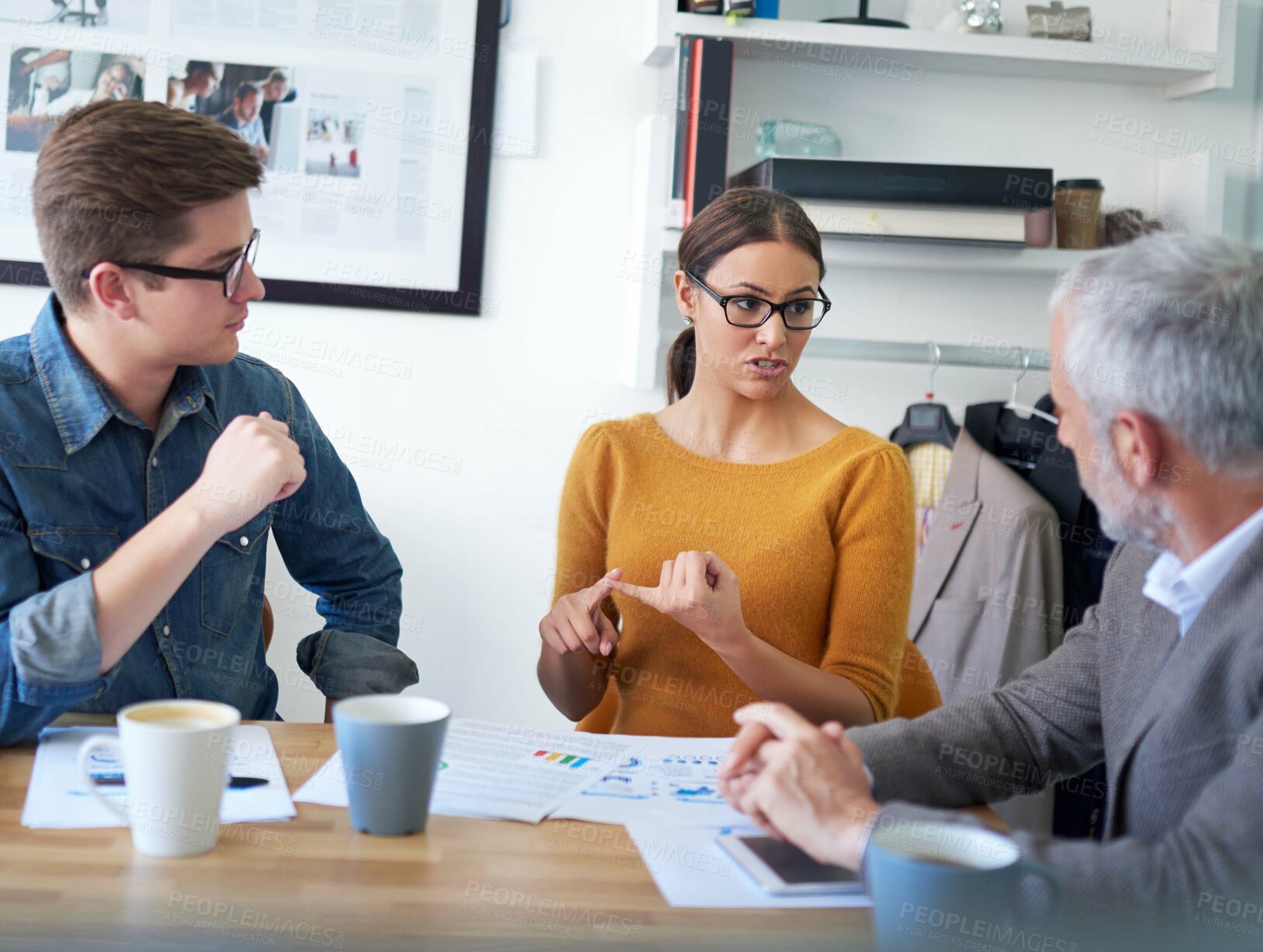 Buy stock photo Woman, men and documents with talking in office with review, graphs and discussion for stats at media company. People, paperwork and planning with team work, charts and feedback at creative agency