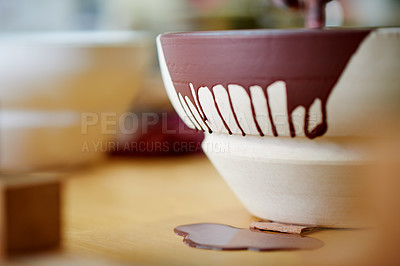 Buy stock photo Paint, bowl and pottery studio for art and craft with creativity, crockery or earthenware with drip. Clay,  handmade or production of product in workshop with sustainable object for small business