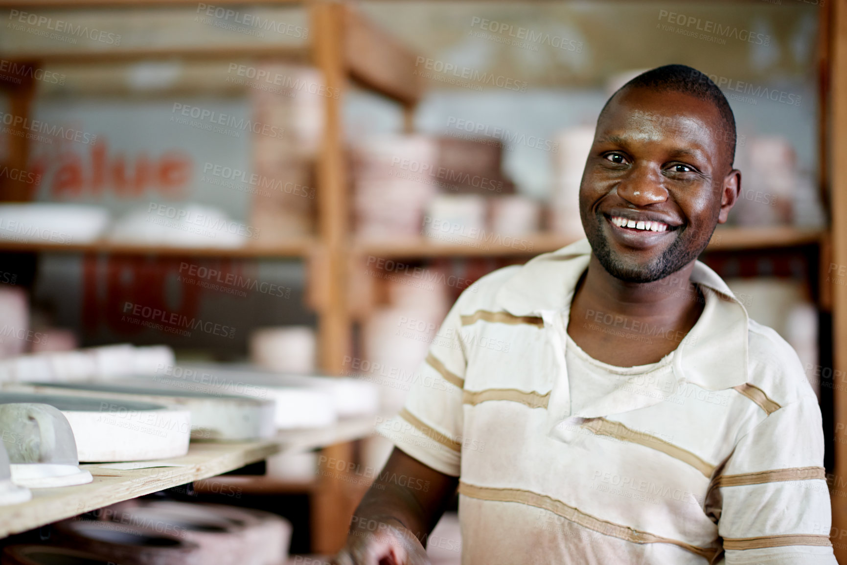 Buy stock photo Portrait, potter and man with smile, creative and confident for ceramic workshop, art and entrepreneur. Small business, artisan and person with skills for sculpture, talent and production in Kenya