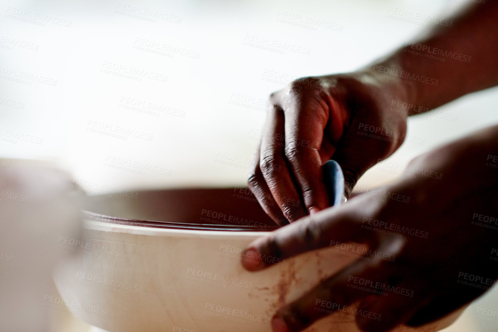 Buy stock photo Sanding, pottery and hands of man in workshop or studio for ceramics, smooth and creative hobby. Artisan, crafting and process with artist person for small business product, clay and bowl design