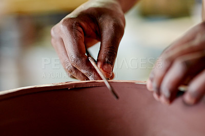 Buy stock photo Hands, closeup and potter in workshop with tool for shaving, carving or smooth texture for ceramic small business. Artisan, creativity and person for pottery, handmade crafts and startup artwork