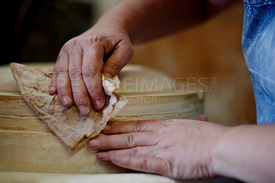 Buy stock photo Cleaning, pottery and hands of person in studio ceramics product, manufacturing and project. Hobby, handmade and handicraft design with closeup of artist in workshop for entrepreneur and talent 