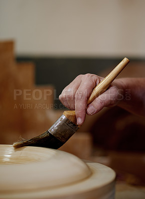 Buy stock photo Hands, pottery and brush at workshop with ceramic manufacturing, craft and sculpture. Person, art and equipment with clay, polish and shape with patterns for results with creativity for texture