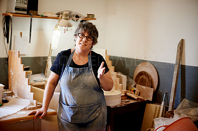 Buy stock photo Apron, creative and pottery with woman in workshop for retail production of ceramics. Glasses, manufacturing and process with potter in design studio for small business startup as entrepreneur