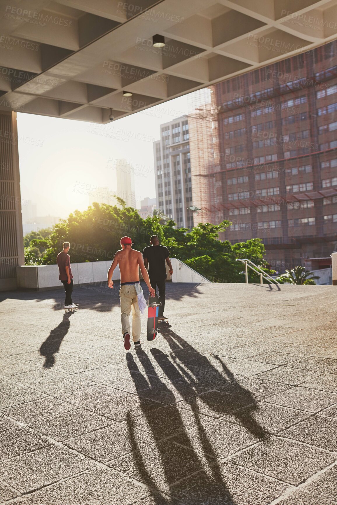 Buy stock photo Training, city and group with skateboard, sports and practice for competition on road, edgy and outdoor. Fitness, together and people with equipment for game, urban and athlete with hobby on street