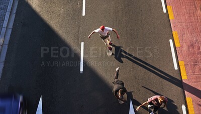 Buy stock photo Active, skating and friends with skateboard, group and race on road in city, fitness and high angle. Outdoor, above and travel for competition on street, skateboarding and practice for game or people
