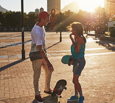 Buy stock photo Friends, skateboard and sunset in street, city or outdoors for fun practice. Man, woman and exercise break with training, skaters and bonding together on urban road for downtown workout and fitness