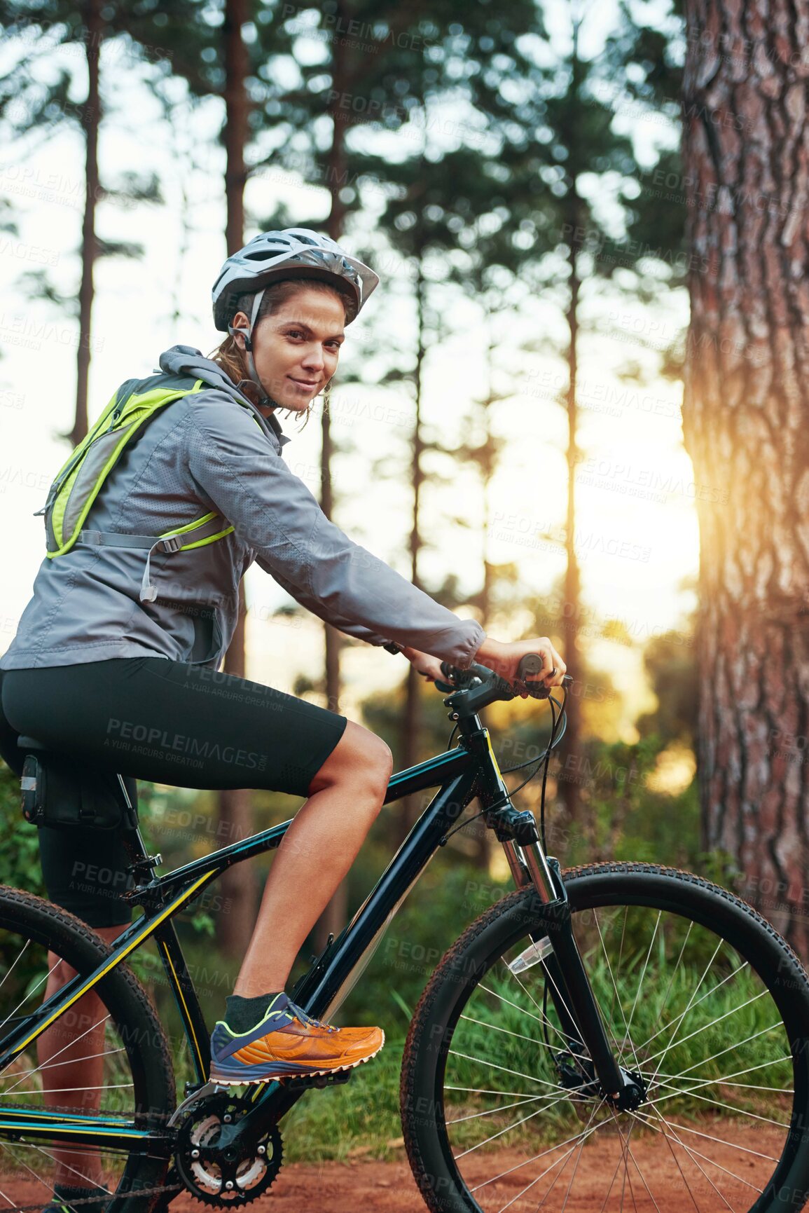 Buy stock photo Woman, portrait and forest on bicycle for adventure travel, fitness and wellness for competition. Athlete, mountain bike and cycling for workout, training and exercise with practice for marathon
