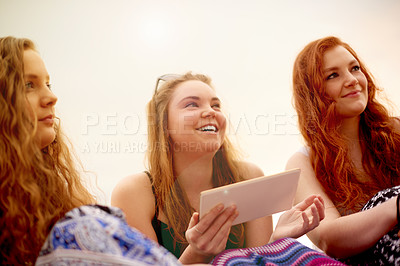Buy stock photo Happy, outdoor or girl friends with tablet for gossip, online download or break on holiday vacation. Women, research or people in park to relax with technology, social media post or news together