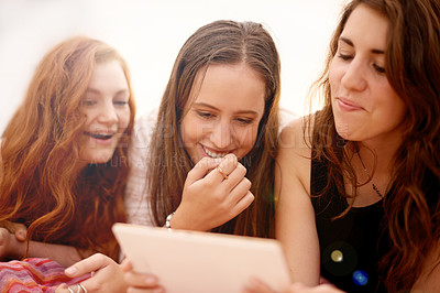 Buy stock photo Happy women, relax and tablet with friends in nature for entertainment, social or online streaming. Female person, group or get together with smile or laughing on technology for comedy or humor