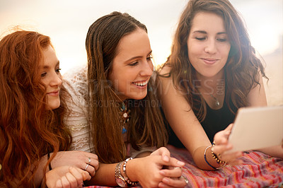 Buy stock photo Outdoor, tablet and women with vacation, friends or bonding together with smile, relax or social media. Group, summer holiday or happy people with tech, digital app or entertainment with website info