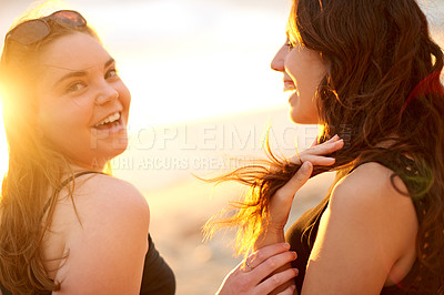 Buy stock photo Smile, sunset and woman friends on beach together in summer for holiday, vacation or weekend. Bonding, happy and having fun with people outdoor on tropical coast of island paradise for getaway
