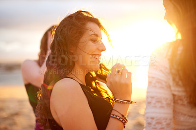 Buy stock photo Girl, friends and happy at sunset, beach and bonding on vacation, break and outdoor in summer. People, group and women with smile, excited and culture at dusk by ocean for holiday in Portugal