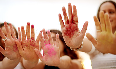 Buy stock photo Studio, group and friends with hands for glitter, festival and decoration for celebration in closeup. White background, people and artistic with creativity for color event, sparkle and fun activity