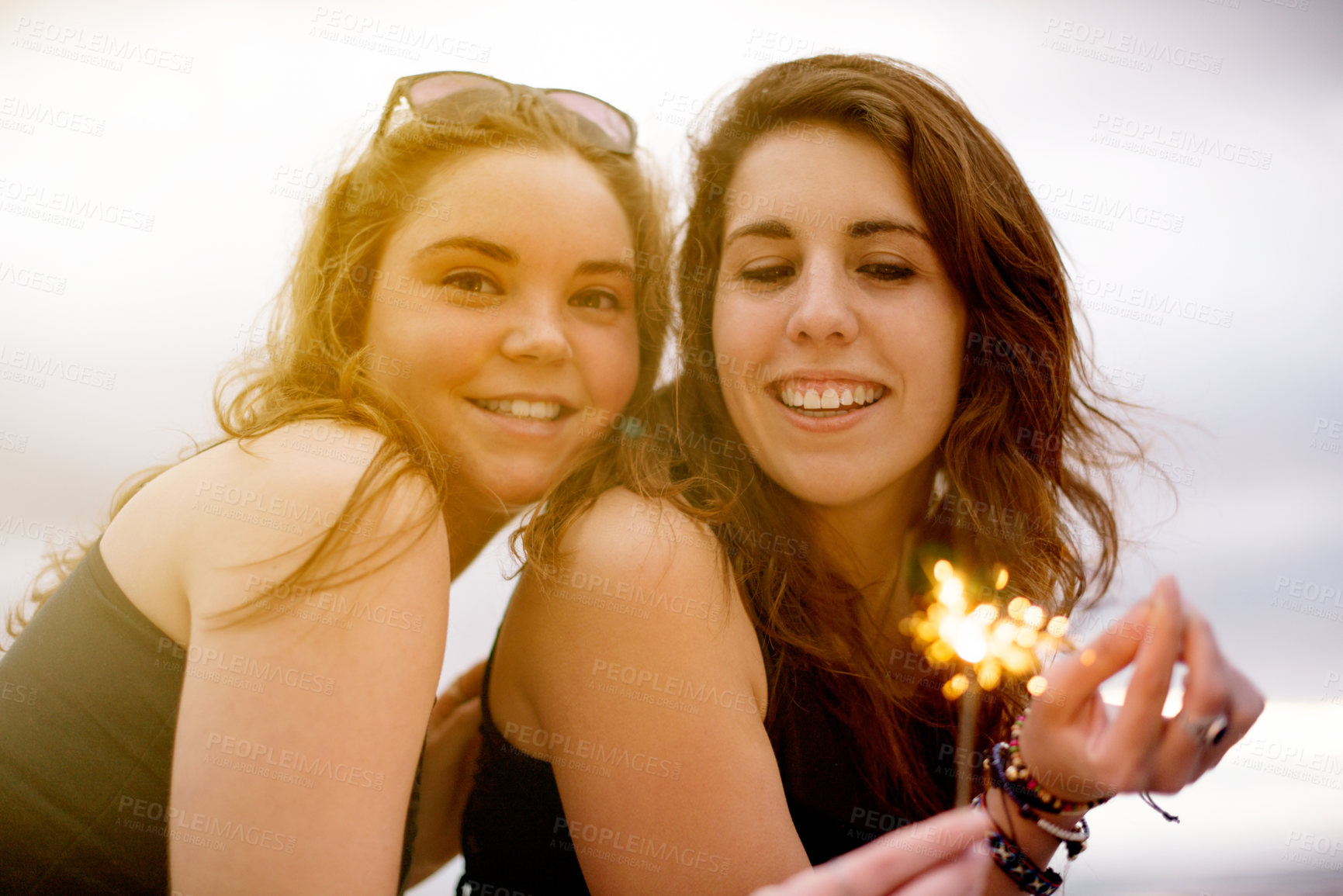 Buy stock photo Smile, friends and girls with sparklers for celebration, new year party and gathering outdoor. Portrait, happy women and firework stick for holiday, vacation and relax together in summer for travel