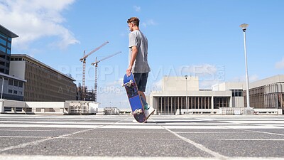 Buy stock photo Man, skateboard and walking in urban city, rooftop and guy for skating challenge on vacation. Fitness, outdoor hobby and skateboarder for practice in downtown, performance trick and holiday for stunt