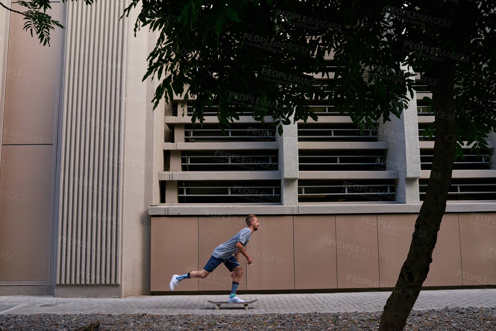 Buy stock photo Ride, athlete and man with skateboard, road and exercise for competition in city, speed and fitness. Outdoor, skateboarder and person with skills for contest, street and wellness for extreme sports