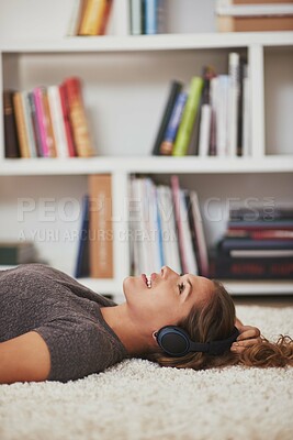 Buy stock photo Headphones, music and woman on floor in home for streaming subscription, playlist and radio. Happy, relax and person in apartment listening to audio, song and track for entertainment, fun and calm