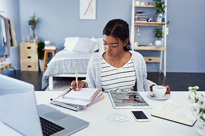 Buy stock photo Girl, laptop and tablet writing in home, study and learning workspace in bedroom for online elearning. Notebook, technology for internet search or social media, coffee and serious student with notes