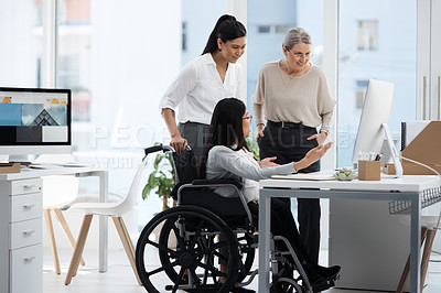 Buy stock photo Full length shot of three diverse businesswoman talking while gathered around a desk in their office