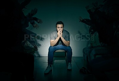 Buy stock photo Portrait, psychology and shadow with man in studio on dark background for rehabilitation. Bipolar, fear and mental health with schizophrenia patient in spotlight for healthcare or medical assessment