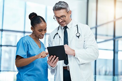 Buy stock photo Teamwork, tablet and healthcare with a doctor and nurse working together as a team in the hospital. Collaboration, internet and medical with a man and woman surgeon at work on an online diagnosis