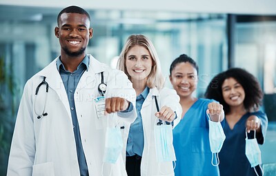Buy stock photo The end of covid, hospital and doctors with face mask off after pandemic medical cure and coronavirus success. Smile, portrait and happy team of healthcare workers take off safety masks with freedom