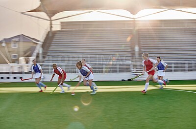 Buy stock photo Women, hockey and sports on grass field, turf and pitch for competition, games and team training in outdoor sunshine. Girls field hockey players contest, action and performance match in stadium arena