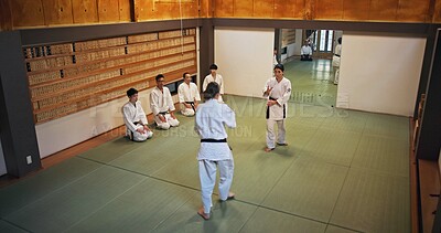 Buy stock photo Martial arts, demonstration and Japanese people with learning, exercise and karate etiquette in dojo. Japan, training and fight studio with sport, discipline and warrior in taekwondo class in gym