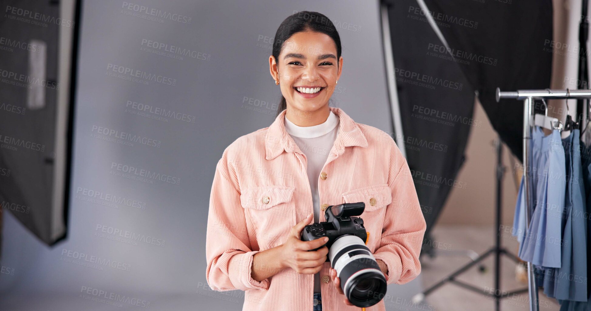 Buy stock photo Happy woman, portrait and camera in studio for production, fashion advertising and behind the scene. Photographer, smile and tech in modeling agency for catalog shoot, content creation or videography
