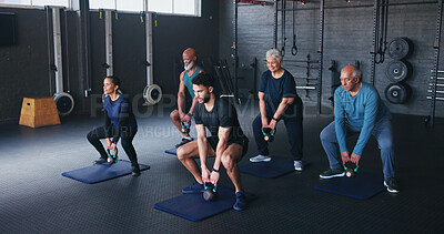 Buy stock photo Fitness, kettlebells and people in gym, instructor and training with wellness, weightlifting and exercise. Health club, trainer and senior group with equipment, strength and strong arms with workout 
