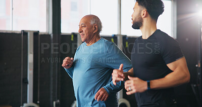 Buy stock photo Personal trainer, senior man and running at gym for fitness with workout, guide and teaching with smile. Coach, cardio and class for training, learning and exercise at wellness club in retirement