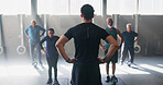 Personal trainer, senior people and group at gym with workout, guide and teaching for fitness. Coach, hip roll and warm up at class for training, learning or exercise at wellness club in retirement