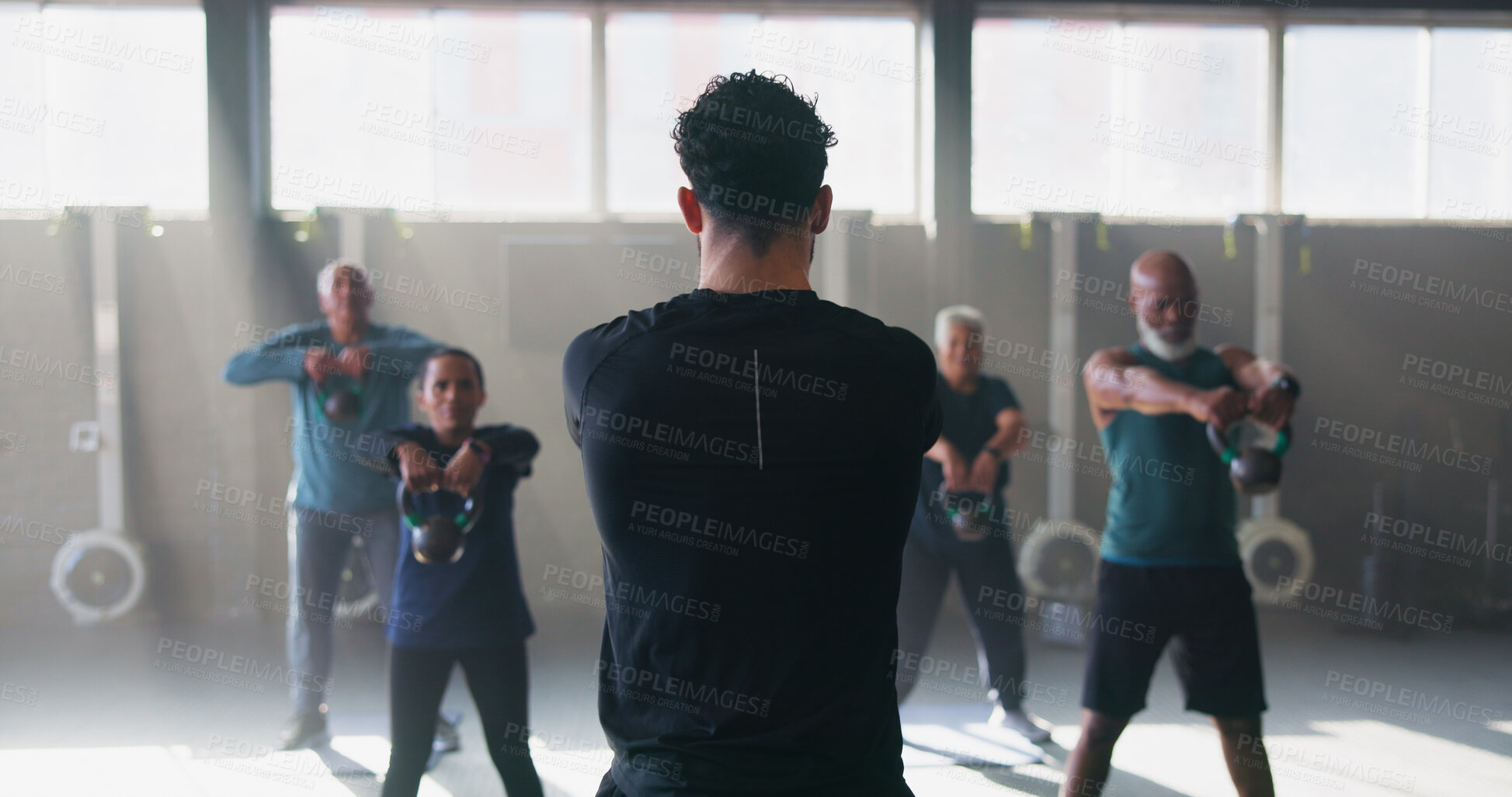 Buy stock photo Coach, senior people and kettle bell at gym with workout, guide and teaching for fitness. Man, group and weightlifting at class for training, learning and exercise at wellness club in retirement