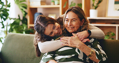 Buy stock photo Hug, smile or visit with mother and daughter on sofa in living room of home for bonding or love. Happy, safety and security with family embracing  in apartment together for relax, support or trust