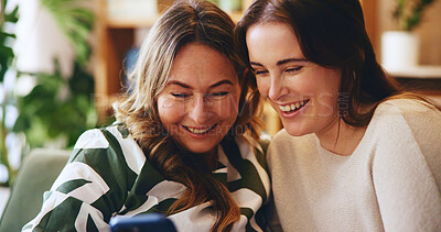 Buy stock photo Bonding, phone and smile of mother with daughter in home living room for communication or visit. App, connection and social media with happy family in apartment for love, relax or text message