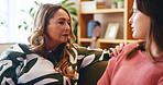 Senior woman, girl and conversation in home, bonding or support with connection on sofa. House, grandmother and female grandchild with communication, healthy family relationship and trust with care