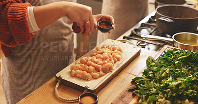 Buy stock photo Food, hands and seasoning with person in kitchen of home for flavor or meal preparation. Chicken, cooking or spice and chef in apartment with ingredients or recipe for diet, health and nutrition