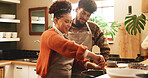 Couple, woman and cooking in kitchen with support for dinner preparation, healthy meal and bonding. Happy, people and help with food recipe in home for nutrition, marriage and relationship connection