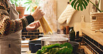 Cooking, hands and pasta with person in kitchen of home for boiling or meal preparation. Food, gas stove or pot and chef in apartment with ingredients or recipe for diet, health and nutrition
