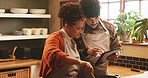 Couple, tablet and cooking in kitchen with pot for recipe, video or guide for meal prep in home. People, man and woman with digital touchscreen, app or partner for food, nutrition or diet in house